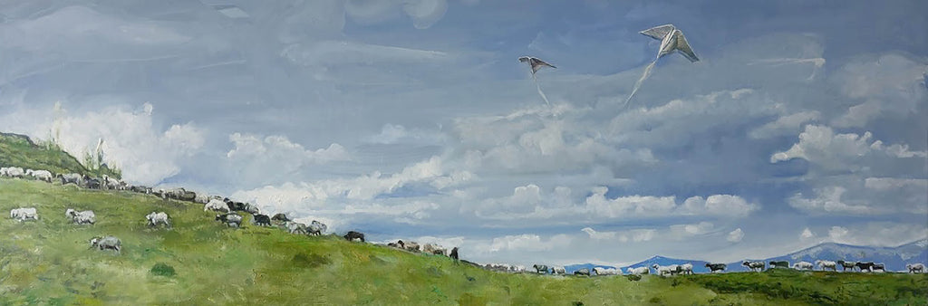 Scenic landscape with a flock of birds flying over a grassy hill with animals.
