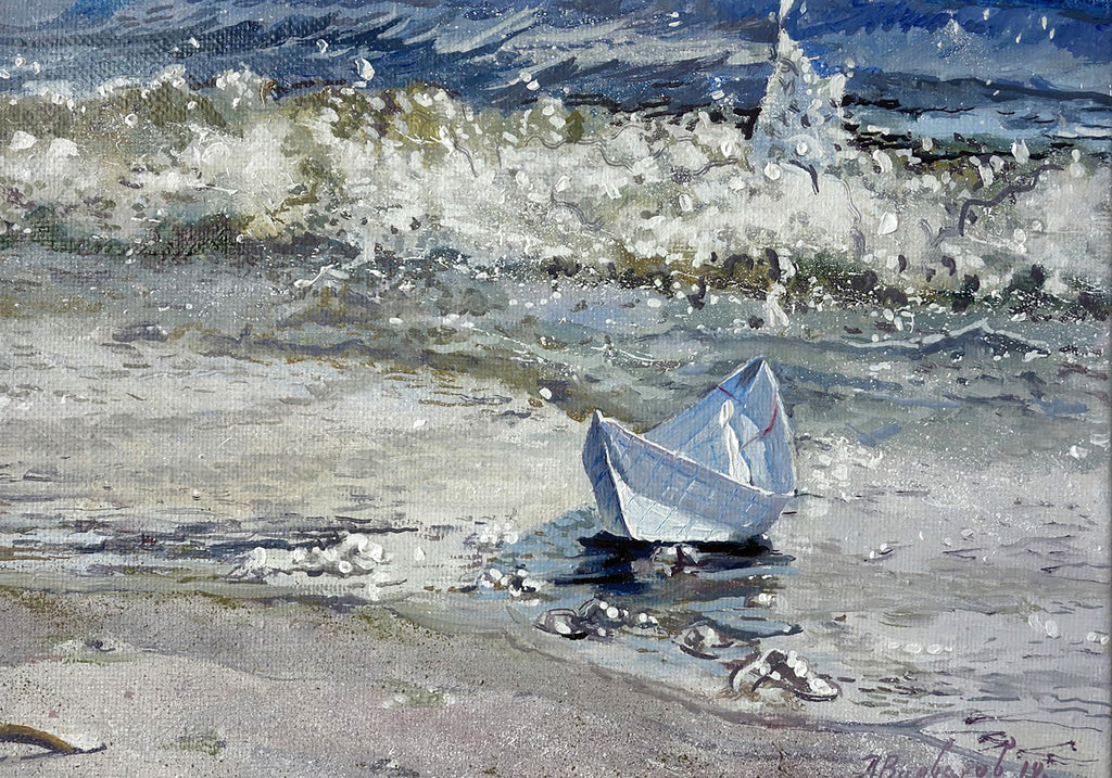 Small sailboat on a sandy beach with waves crashing in the background
