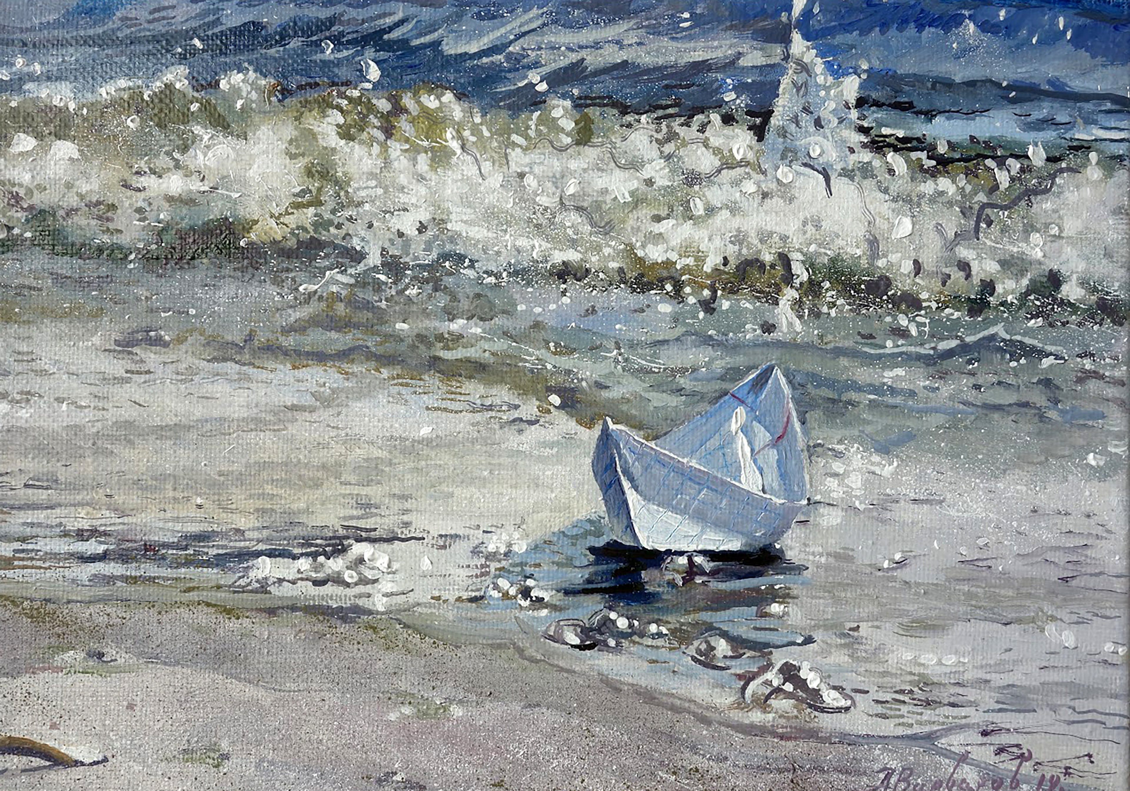 Small sailboat on a sandy beach with waves crashing in the background
