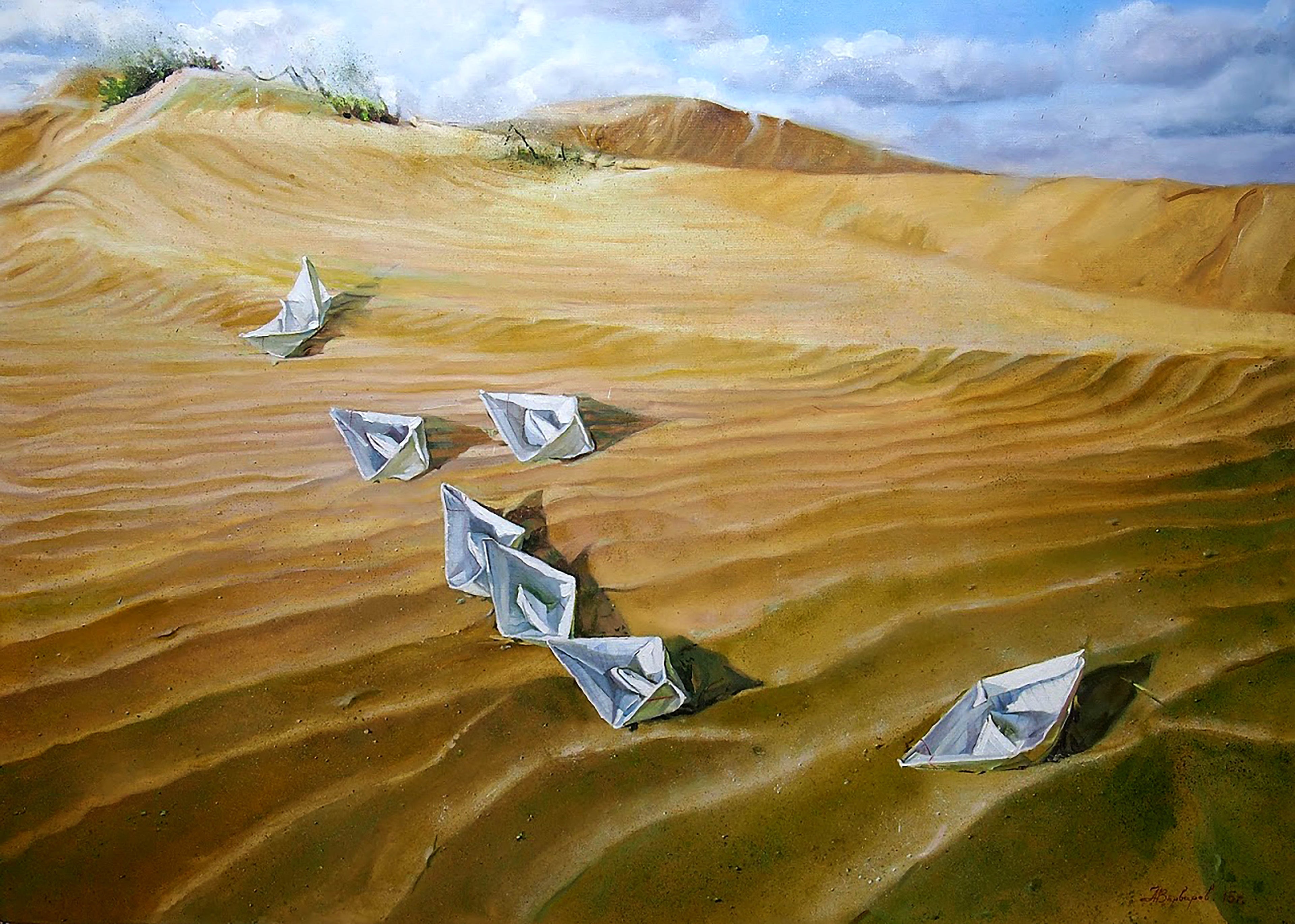 Paper boats on sand with a blue sky and clouds