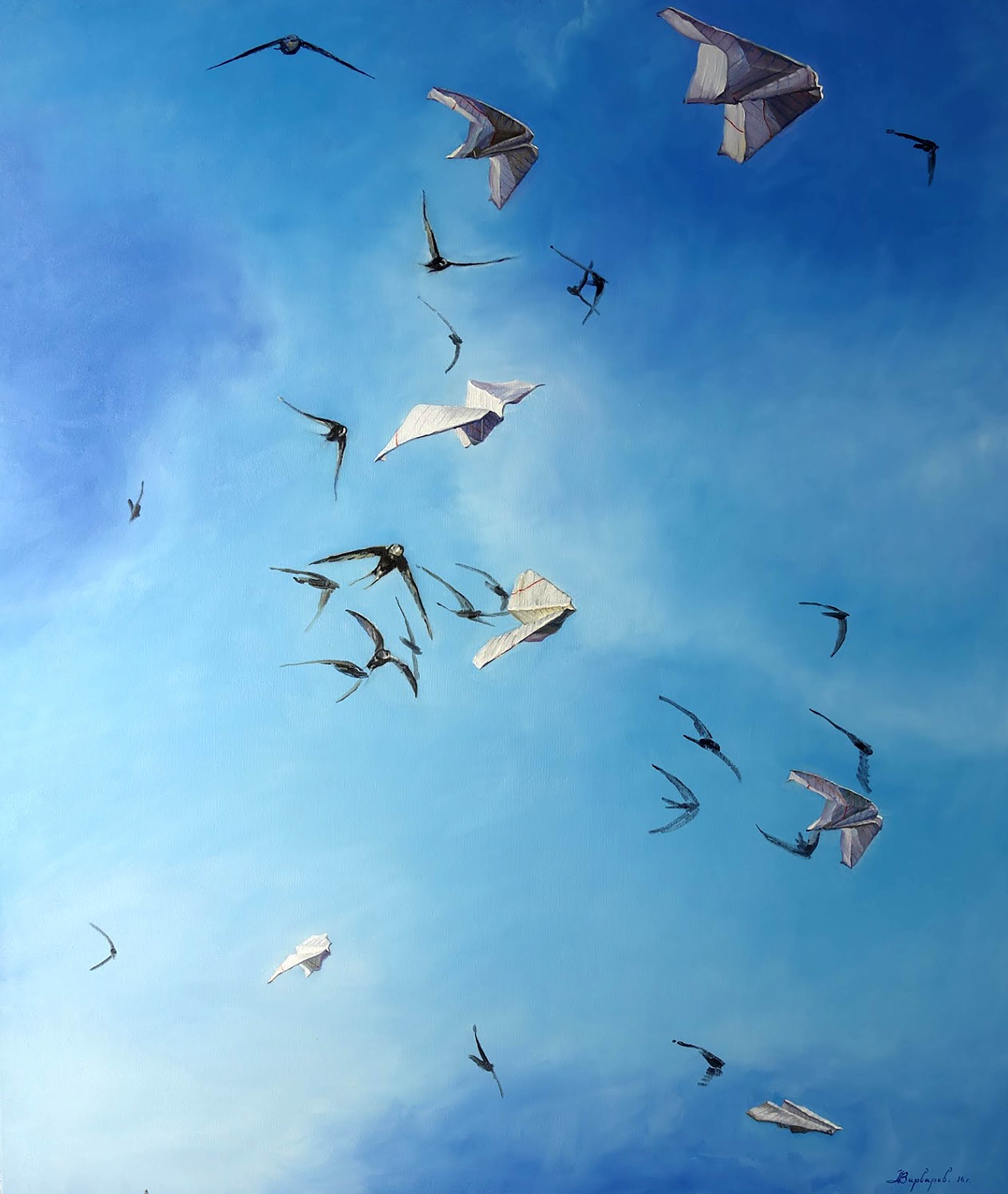 Birds flying against a blue sky