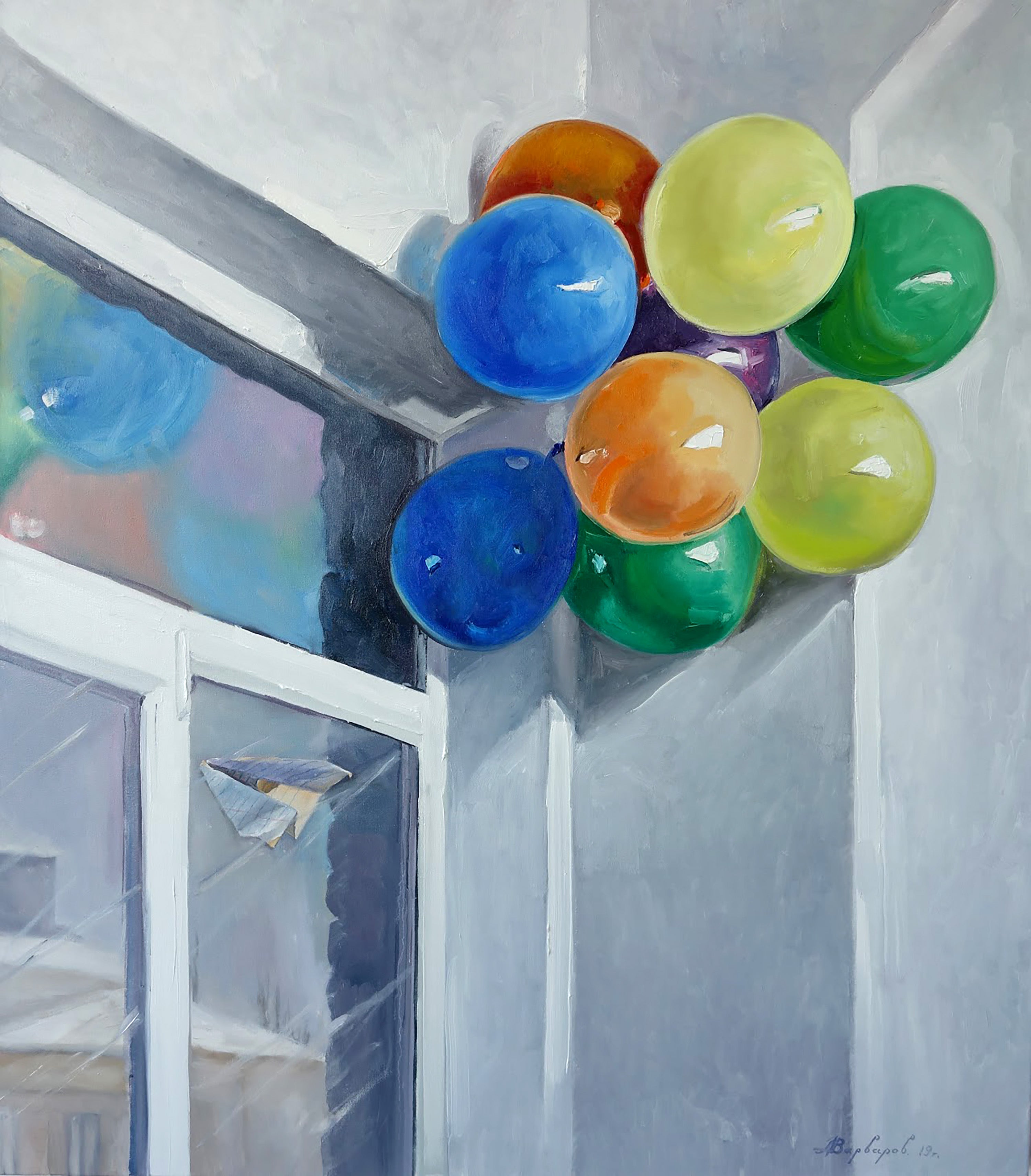 Colorful balloons in a corner with a reflective surface