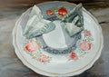 Fragile glass on a decorative plate with floral patterns