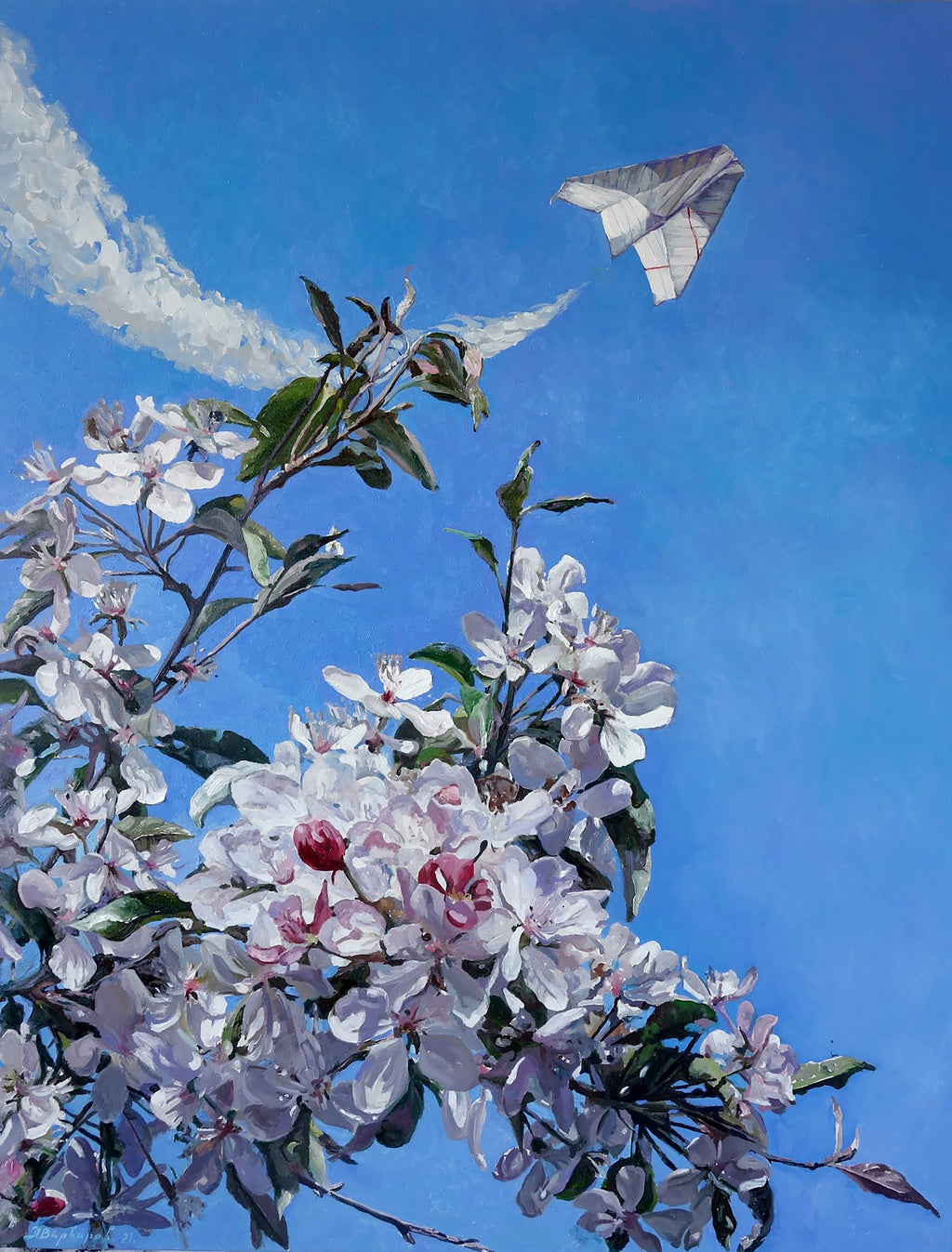 Flowering tree branch with white and pink blossoms against a blue sky.