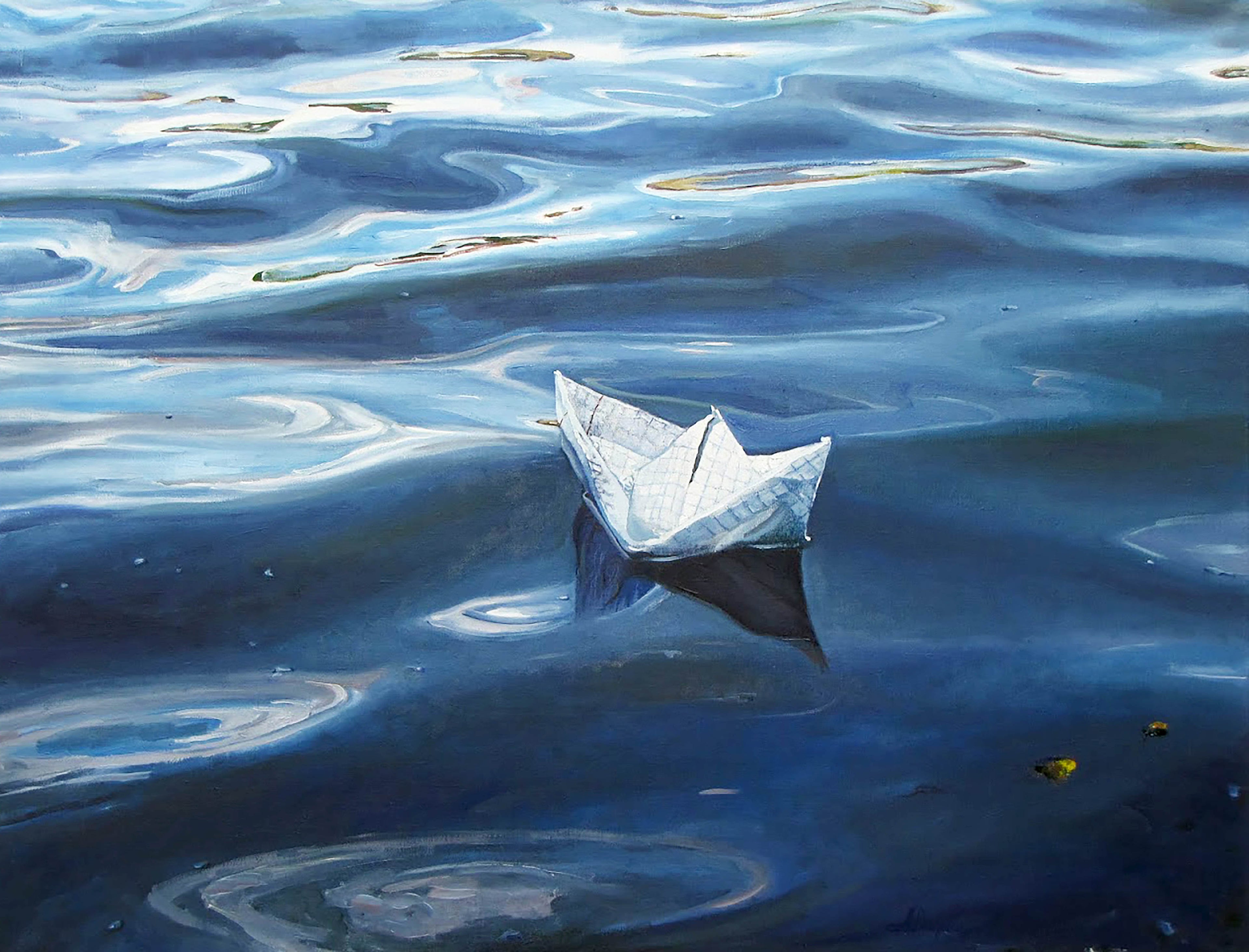 Paper boat floating on water with ripples