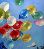 Colorful balloons against a blue sky