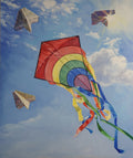 Colorful kite with a rainbow design flying against a blue sky with clouds.
