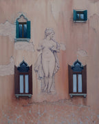 Statue on a textured wall with decorative windows