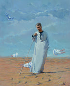 Man in a long white robe standing in a desert with kites flying around him.