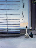 Two chess pieces on a surface with blinds and a window in the background