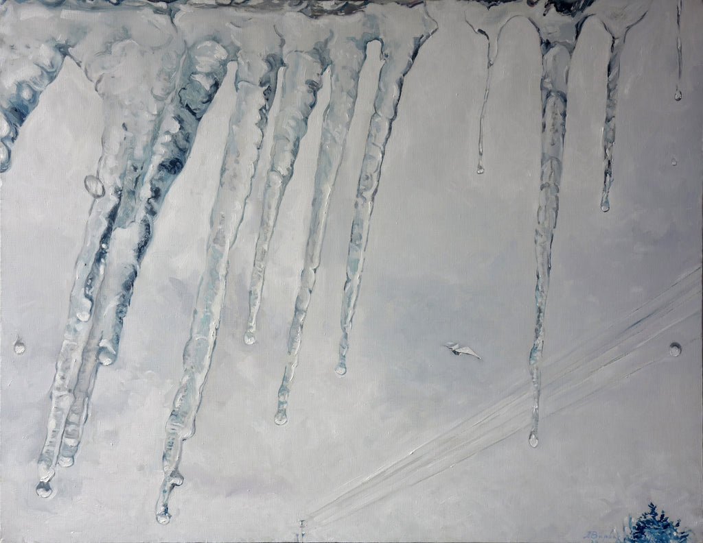 Icicles hanging from a roof in a snowy landscape