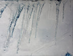 Icicles hanging from a roof in a snowy landscape
