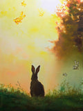 Rabbit in a field with a warm, glowing sky and trees