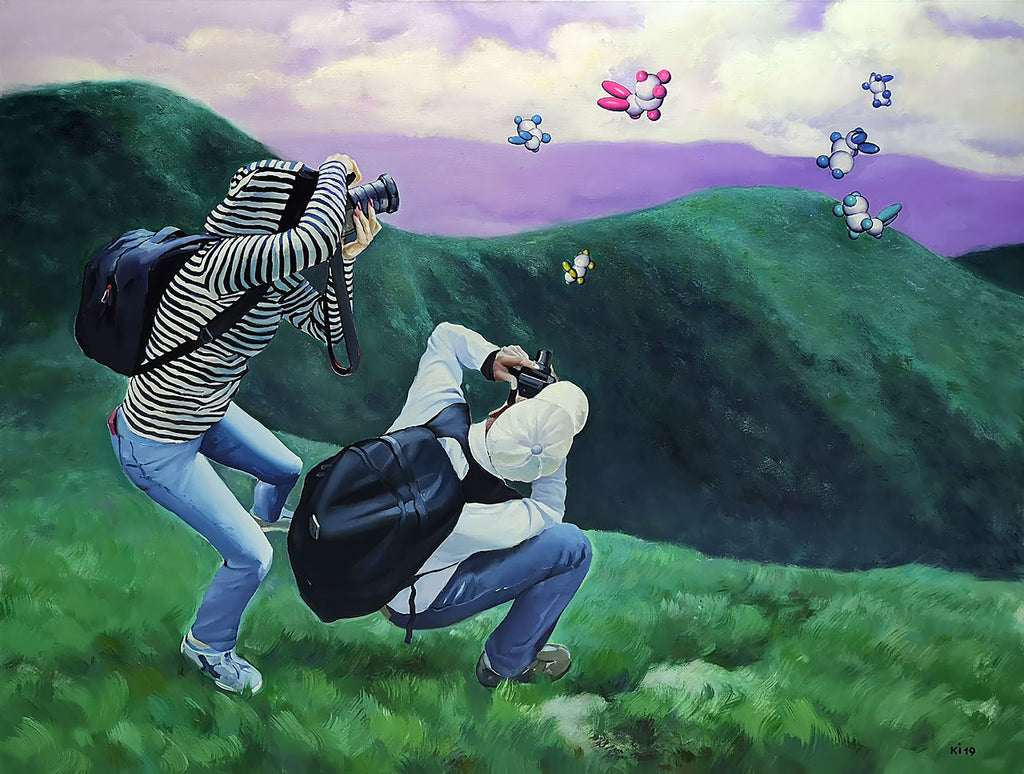 Two people taking photos of colorful butterflies in a scenic landscape.