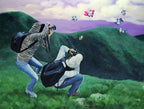 Two people taking photos of colorful butterflies in a scenic landscape.