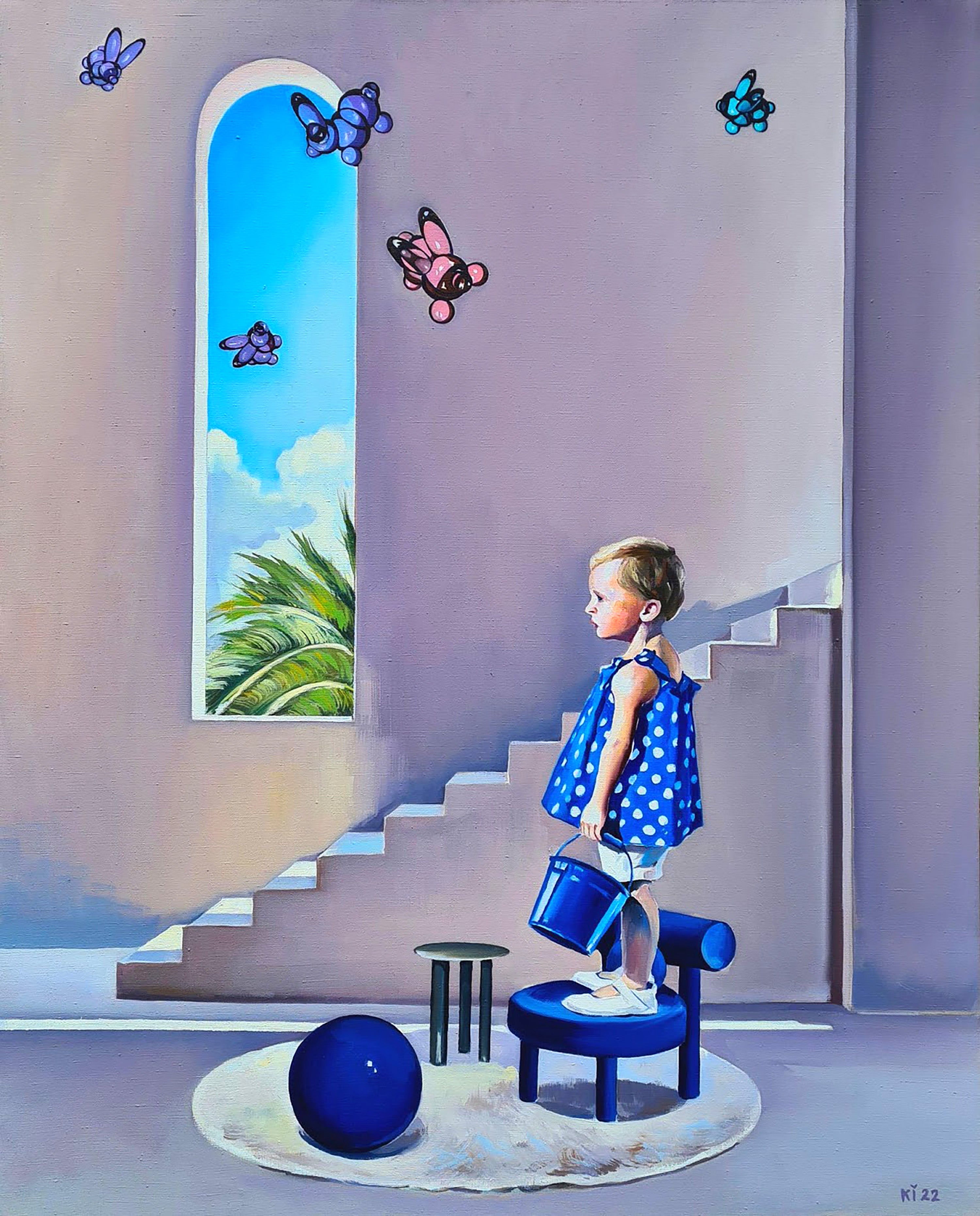 Child in a polka dot dress standing on a stool near a window with butterflies and a blue ball on the floor.