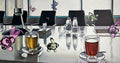 Conference room with a round table, chairs, and decorative elements.