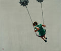 Person in a green dress swinging on a swing set against a plain background