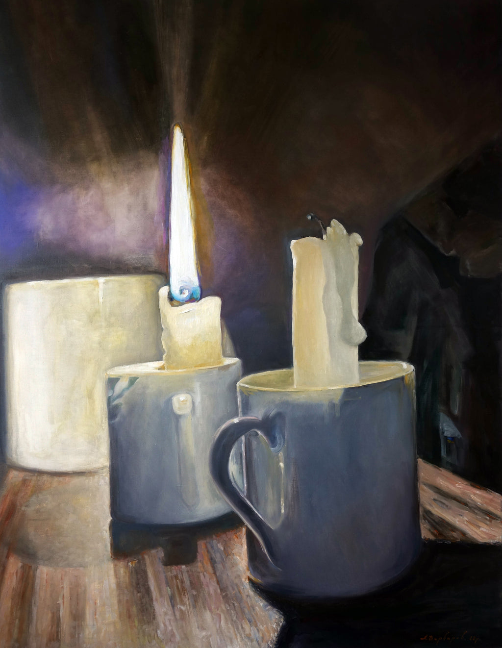 Candle and mugs on a wooden surface with a dark background
