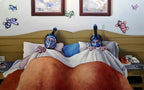 Two people in bed with snorkeling gear on, surrounded by butterfly decorations.