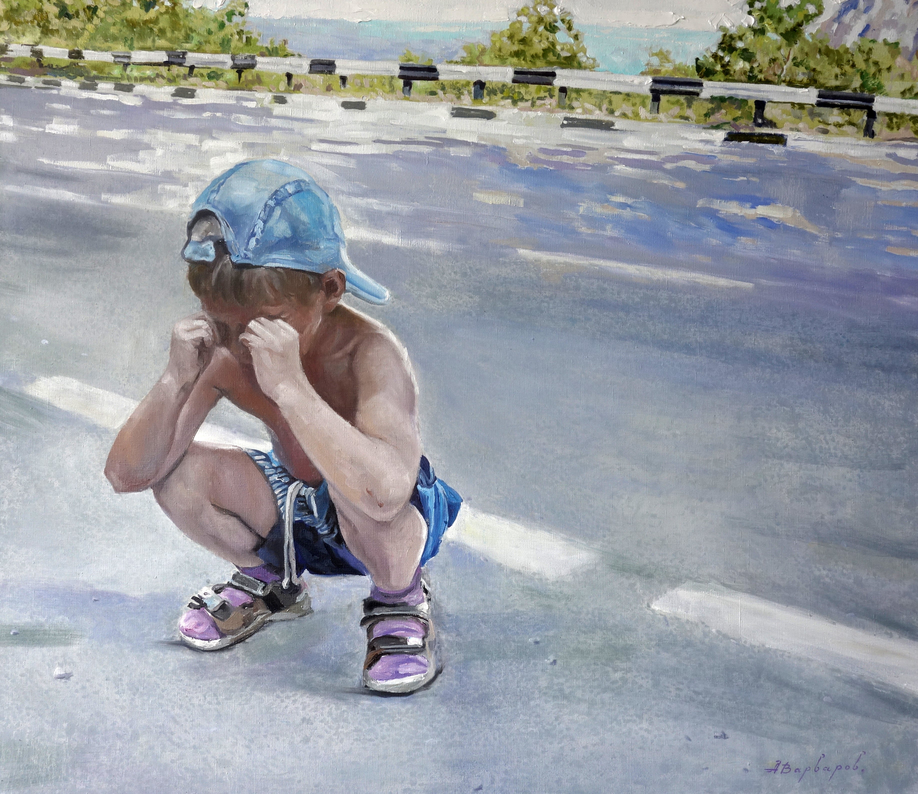 Child squatting on a road with a blue cap and shorts, surrounded by nature.