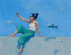 Woman in green pants and white top sitting on a ledge with fish around her, against a blue background.
