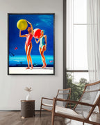 Framed artwork of two women with beach balls in a modern room.