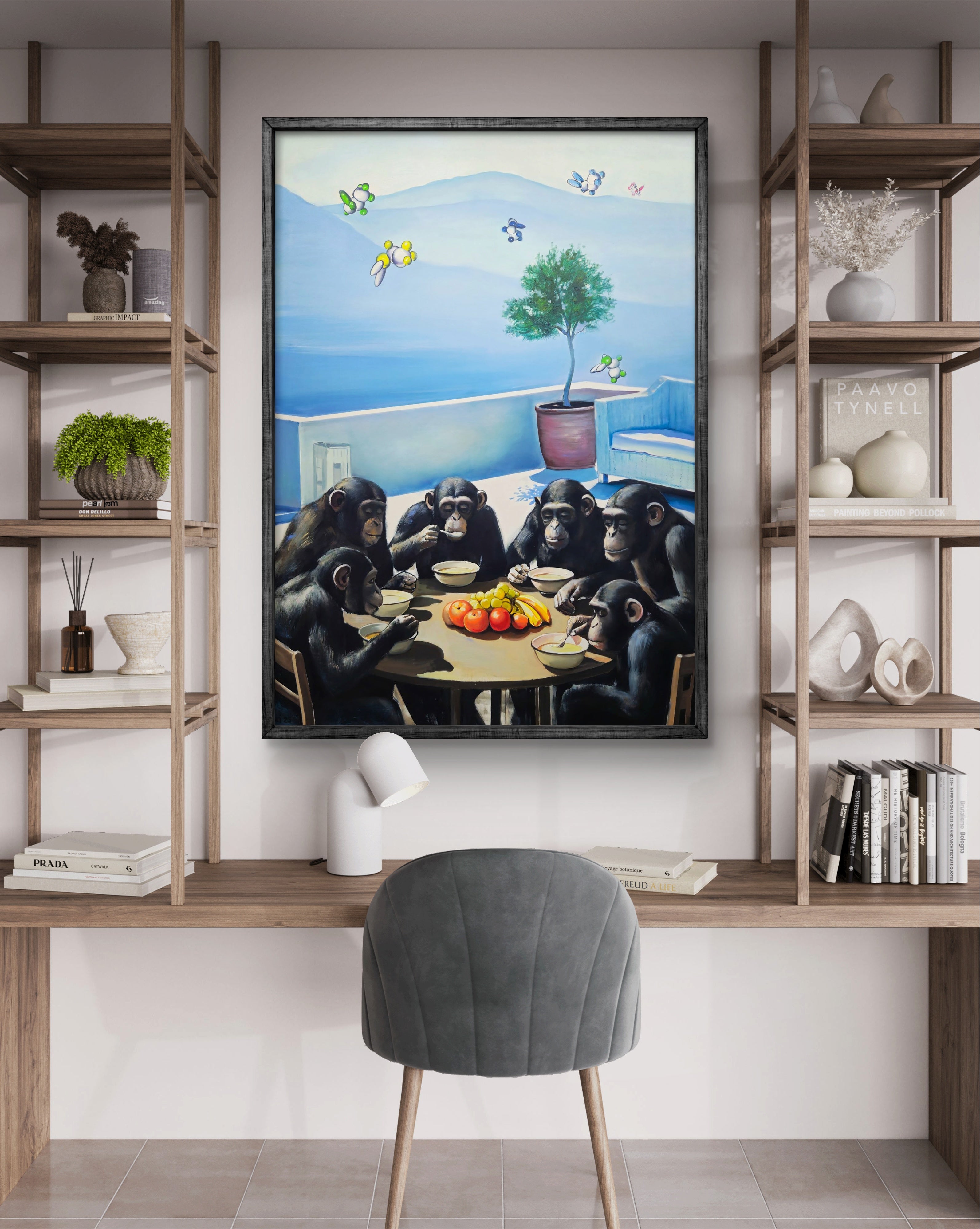 Framed artwork of chimpanzees at a table with a scenic background, displayed in a room with wooden shelves and a chair.