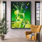 Framed artwork of a green drink with lime slices on a wall above a yellow armchair.