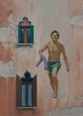 Man in green shorts holding a purple towel against a textured wall with windows.