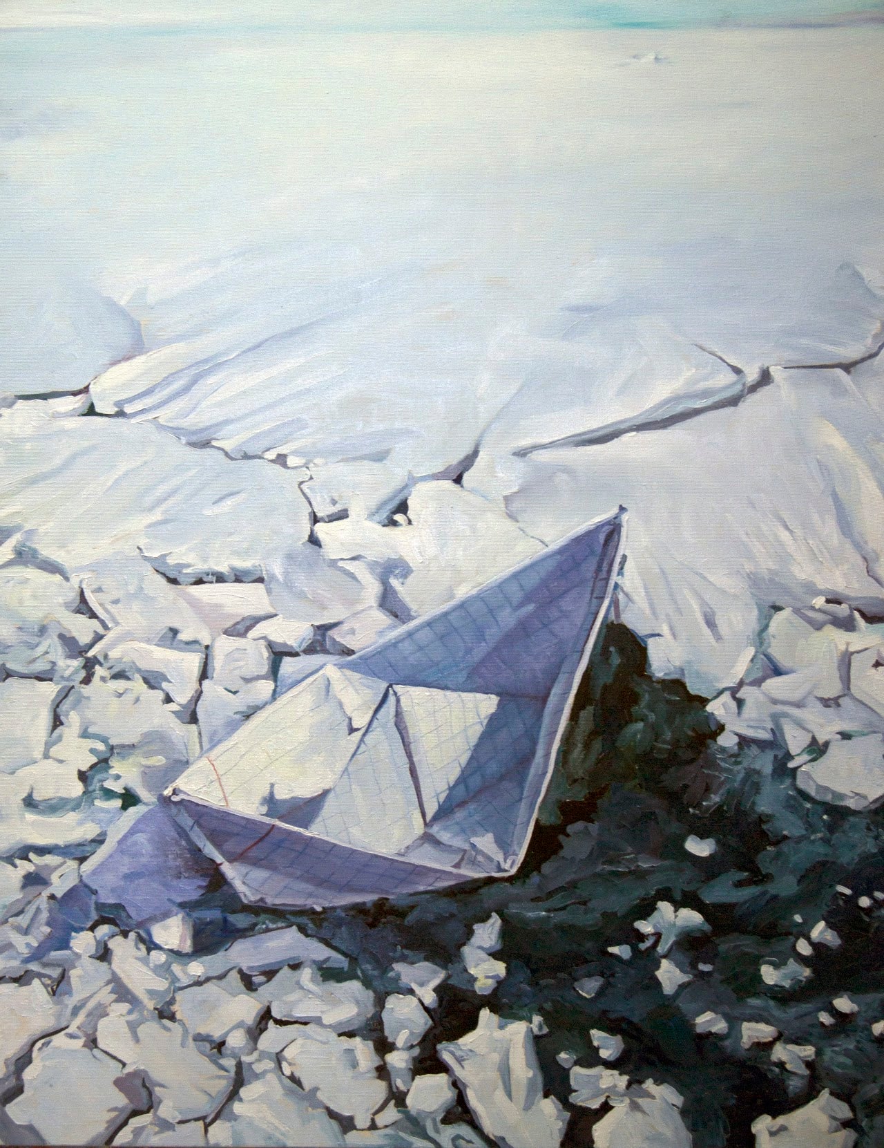 Paper boat on a frozen water surface with cracked ice