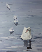 Swan floating on water with icebergs in the background