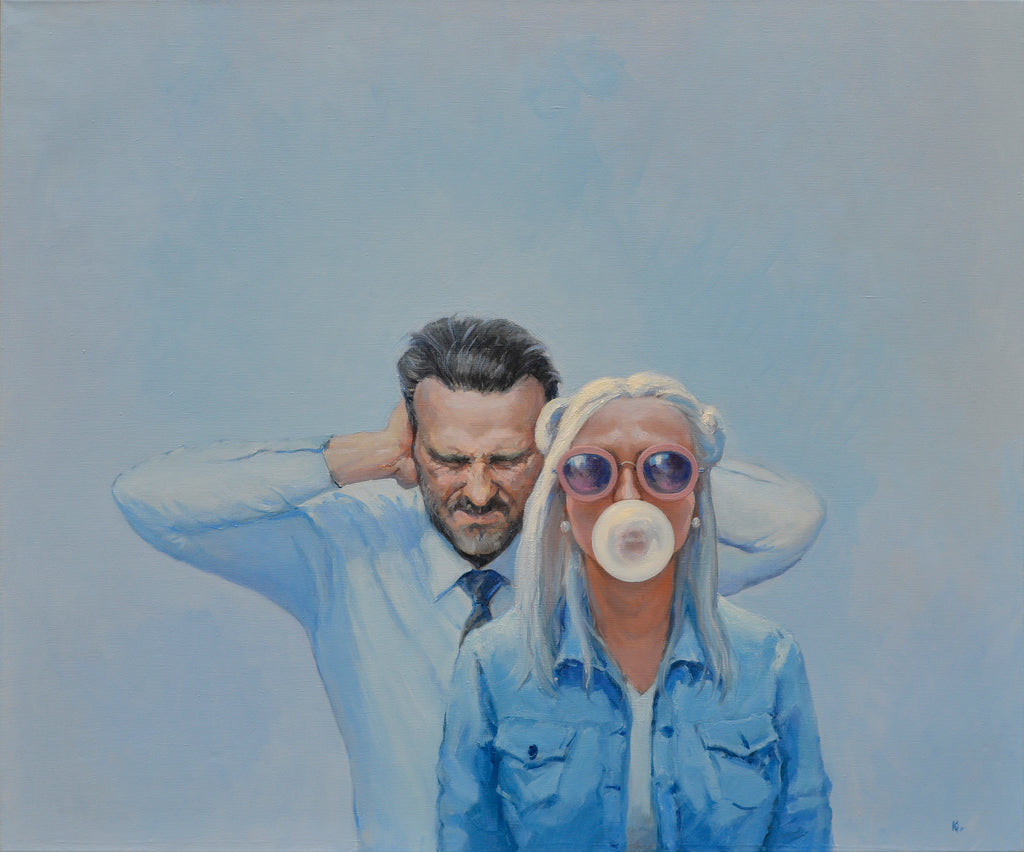 Two people, one with a bubble gum bubble, against a blue background