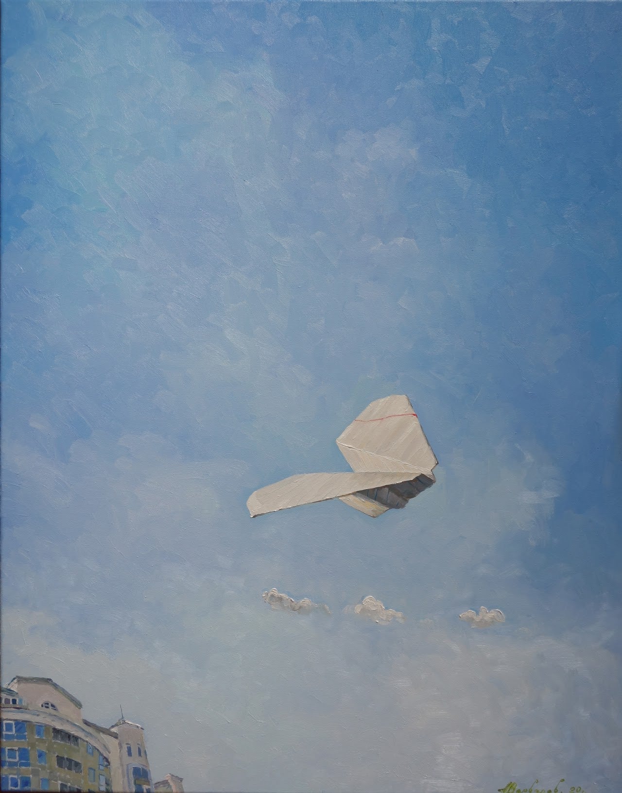Paper airplane flying against a blue sky with buildings at the bottom