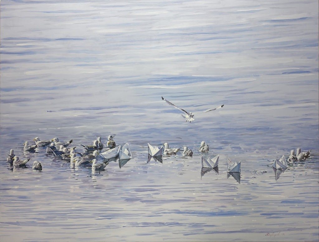 Seagulls on a calm water surface with a single seagull flying above.