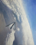 Unmanned aircraft flying over a cloud-covered landscape