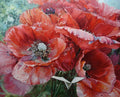 Close-up of red poppies with a blurred green background
