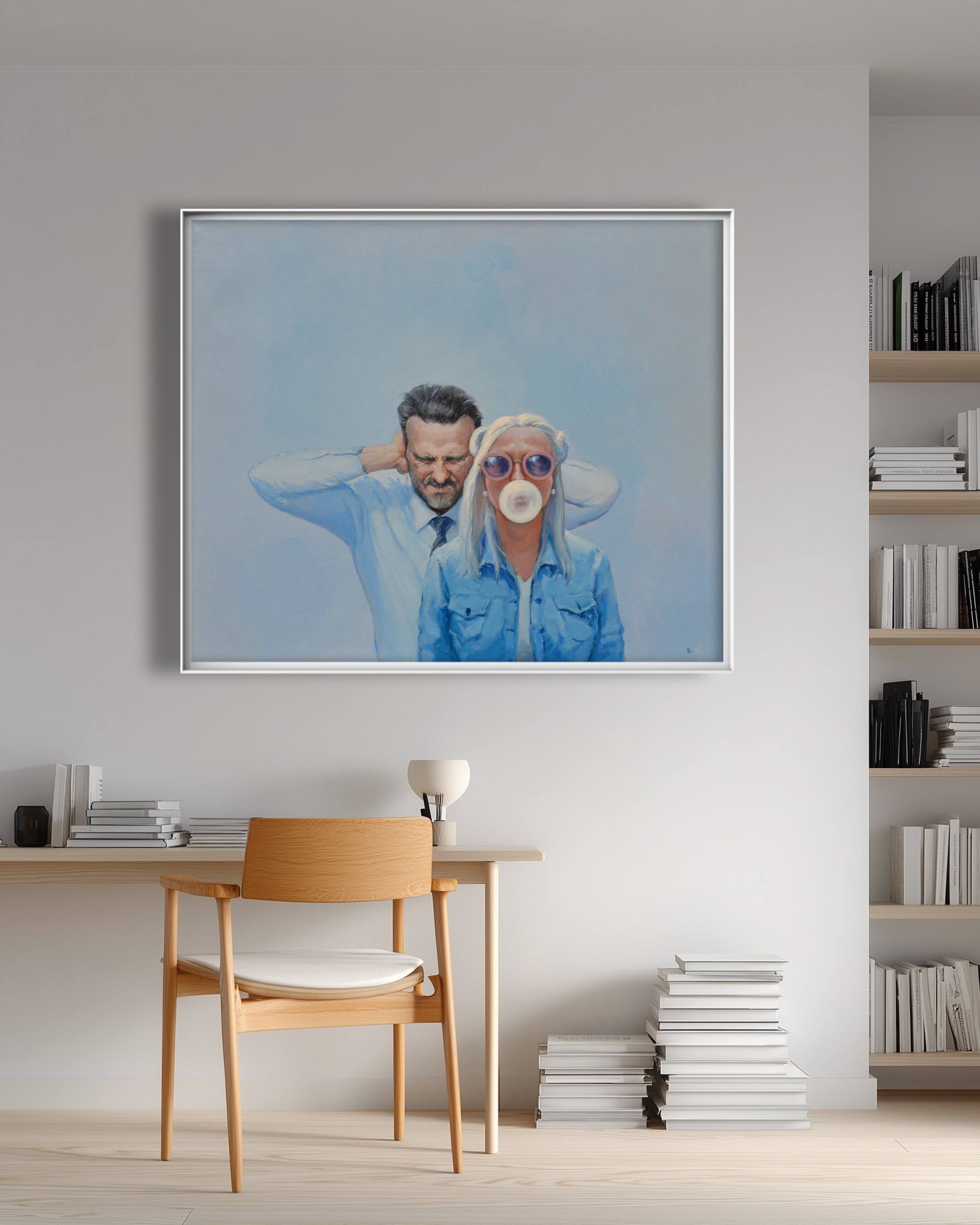 Framed artwork of a man and woman with a blue filter in a modern room.