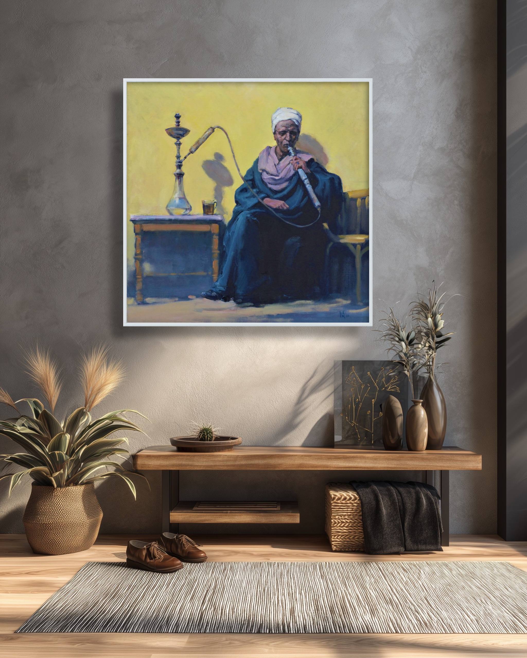Framed artwork of a man smoking a hookah on a wall in a room with decor elements.