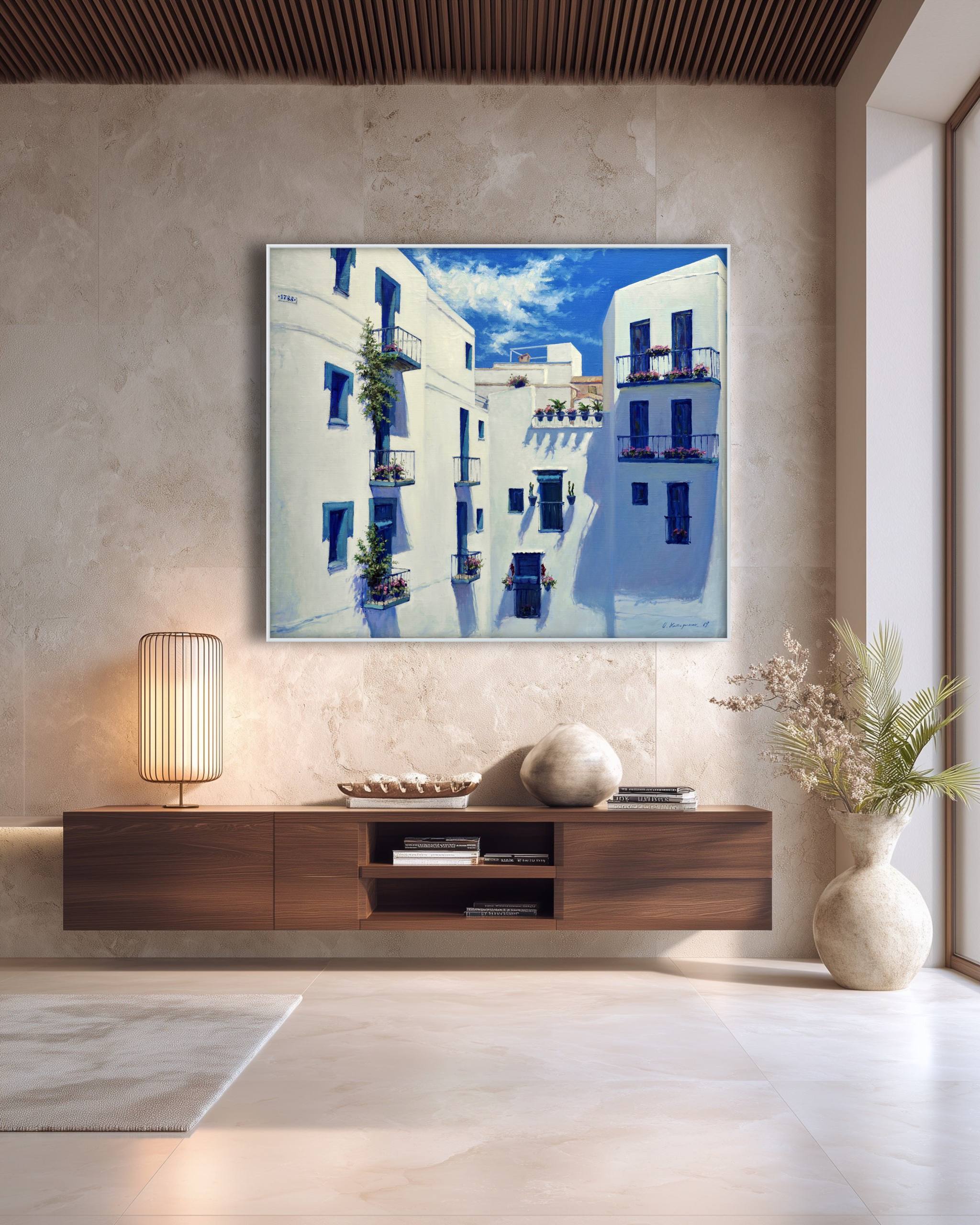 Modern living room with a painting of a Mediterranean street on the wall.