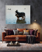 Framed artwork of two dogs in water above a brown sofa with decorative pillows.