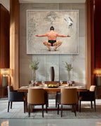 Dining room with a large wall art piece featuring a man in a yoga pose.