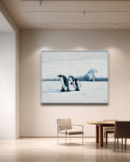 Framed artwork of penguins on a wall in a modern room with furniture.