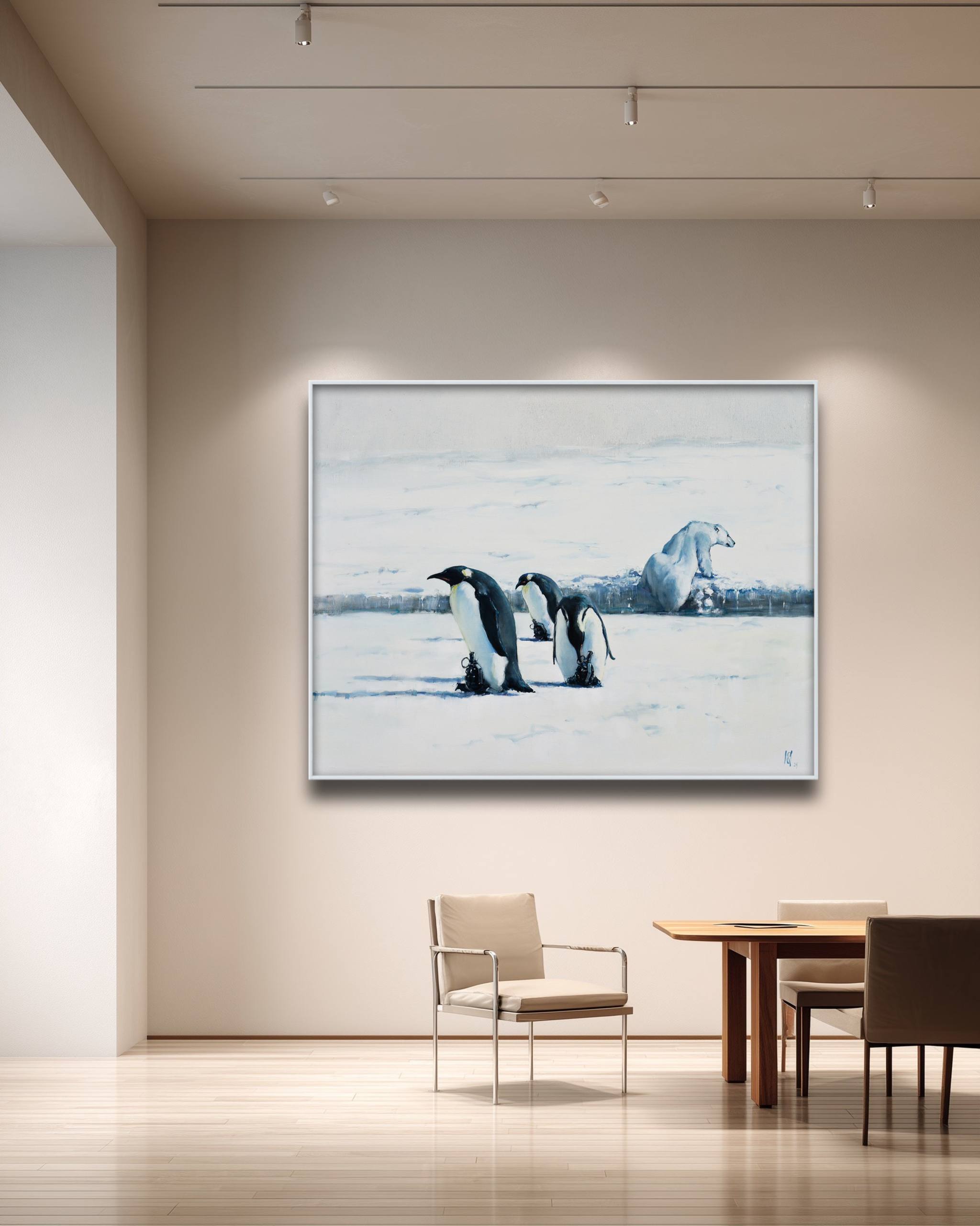 Framed artwork of penguins on a wall in a modern room with furniture.