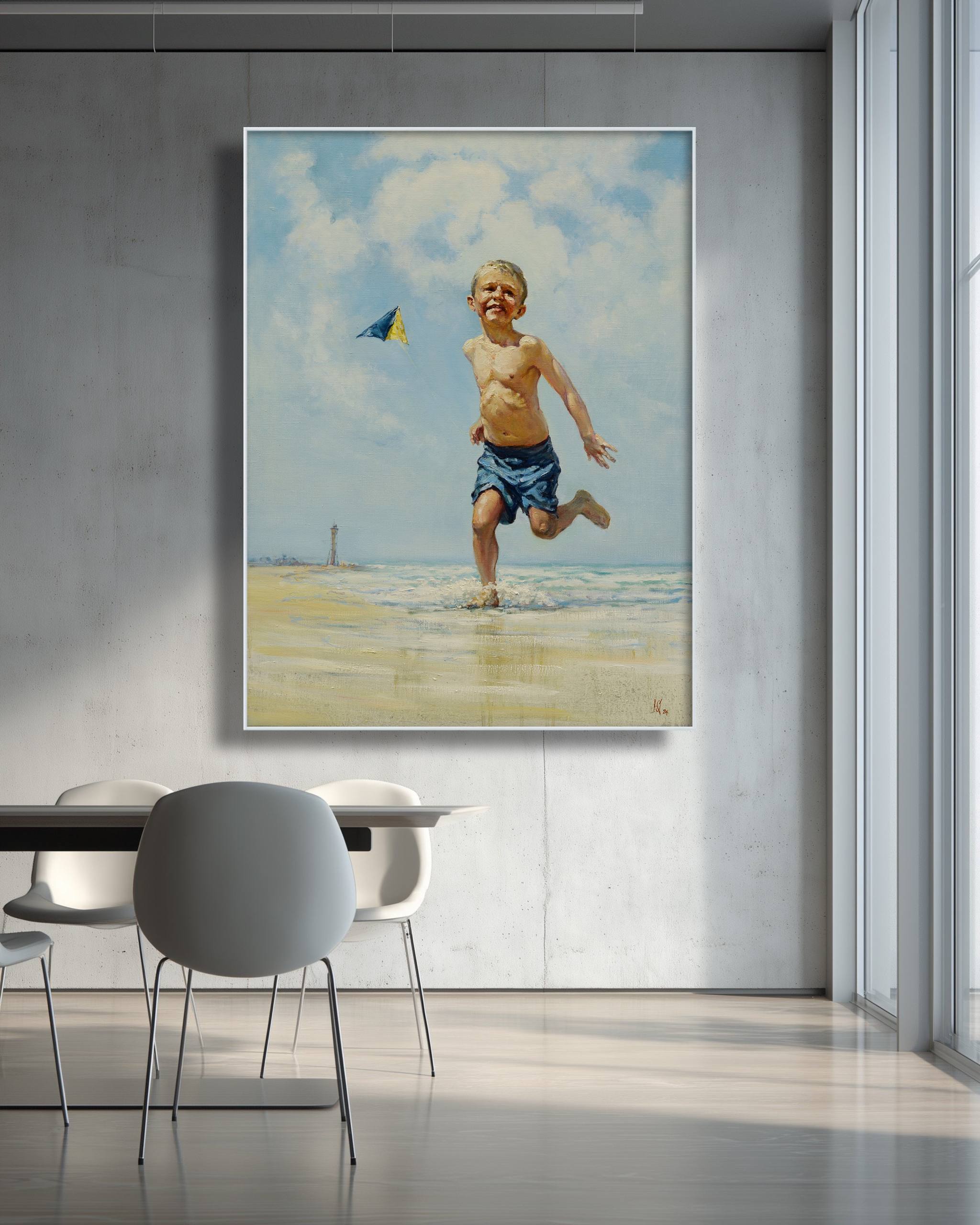 Framed painting of a child running on a beach with a kite, hanging above a modern dining area.