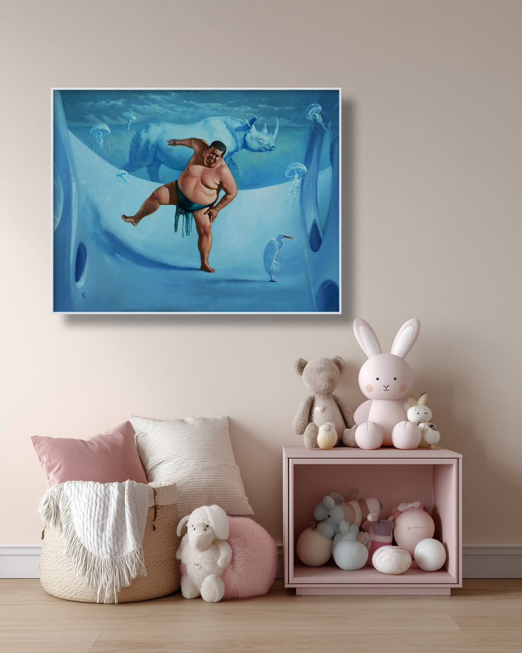 Framed artwork of a man in swim trunks on a wall above a shelf with toys.