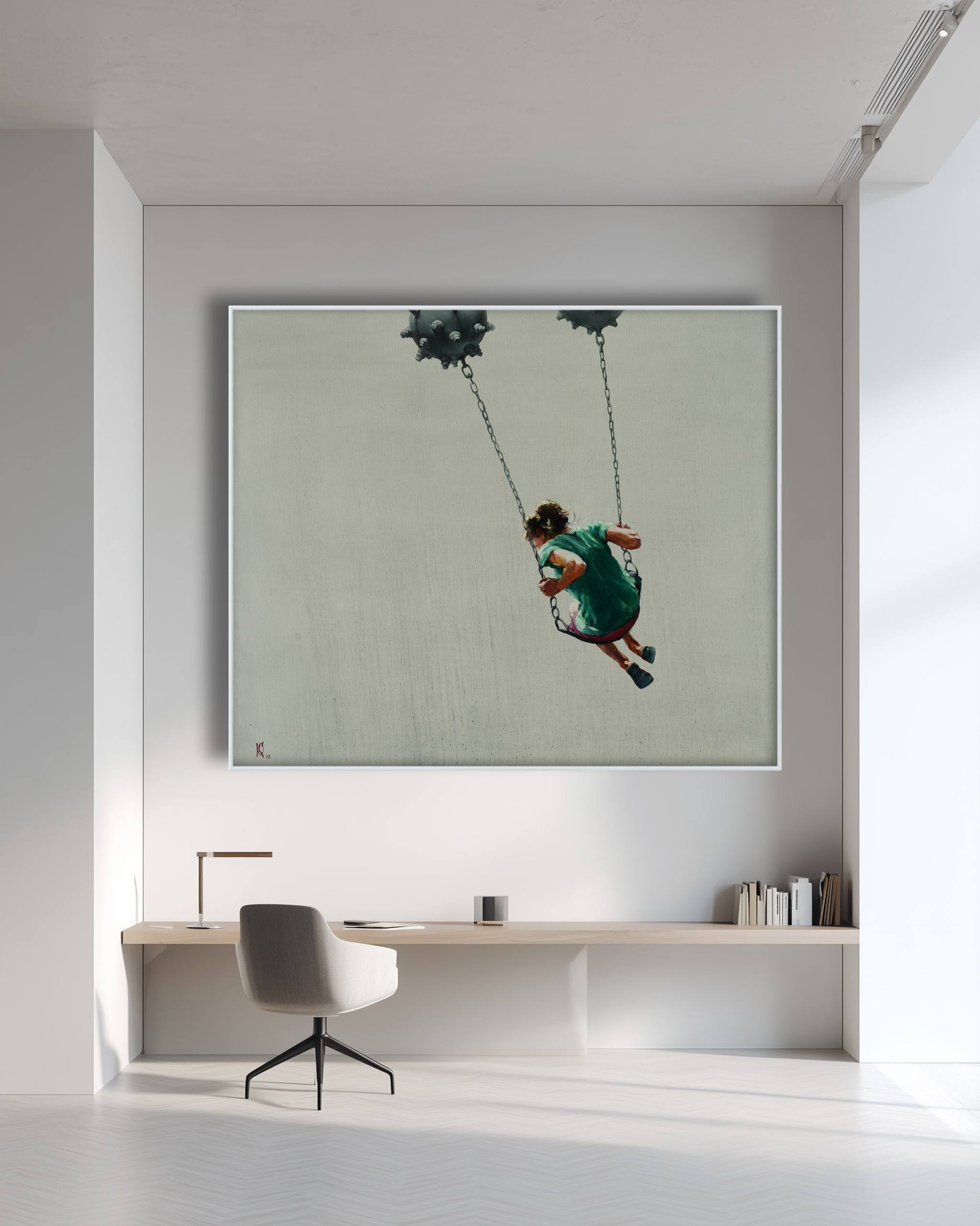 Modern office interior with a large framed photograph of two people on a swing above a desk.