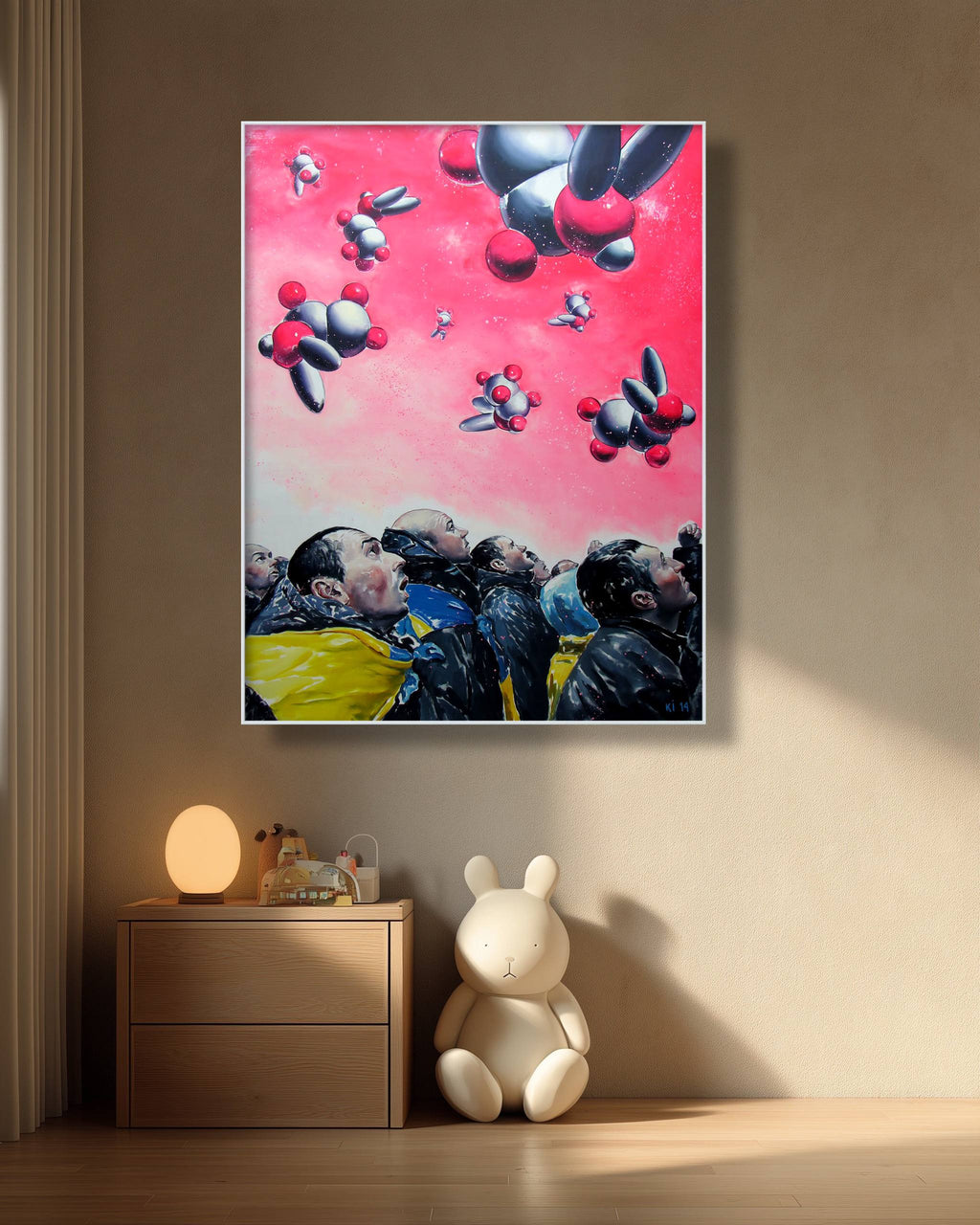 Colorful abstract painting of rabbits on a pink background, displayed in a room with a wooden cabinet and plush toys.