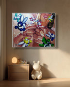 Abstract painting of a woman with colorful balloons on a wall above a wooden cabinet and plush toy.