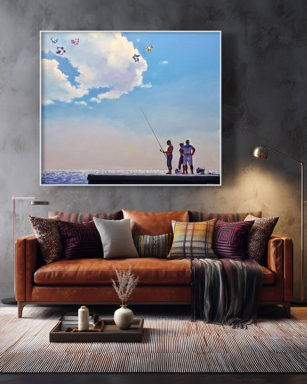 Framed artwork of two people fishing on a boat above a brown sofa with decorative pillows.